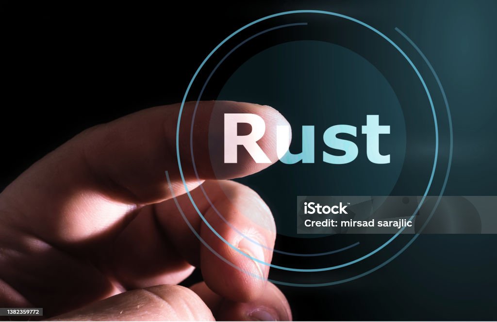 Hand pressing Rust button on virtual screen. Rust programming language. Applying Stock Photo