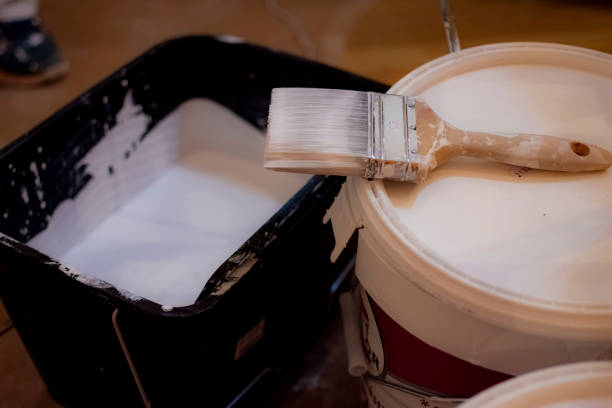 istock Painters refurbishing a small apartment. 1382371502
