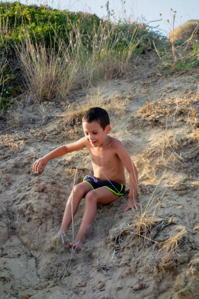 Little boy playing in the sand