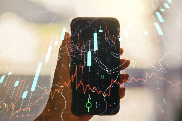 istock Multi exposure of abstract creative financial chart with world map and hand with cell phone on background, research and analytics concept 1382372730