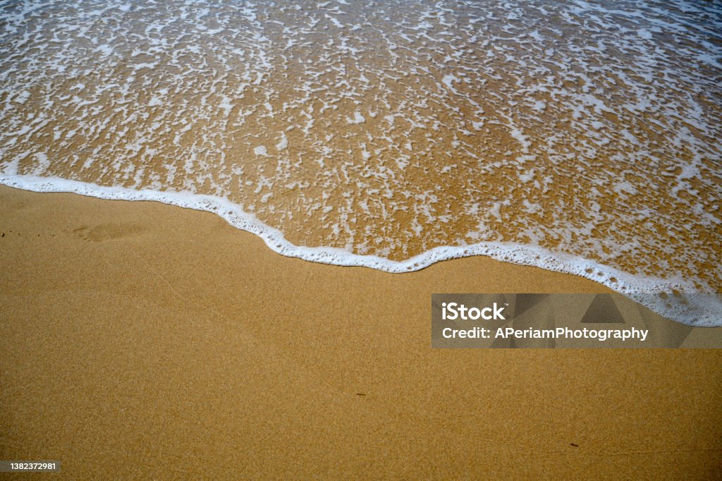 Sand and water on the beach close up of Sand and water on the beach Abstract Stock Photo