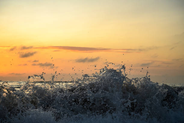 Waves on a beach at sunrise