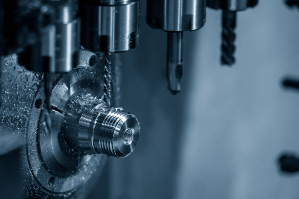 istock The multi-tasking CNC lathe machine swiss type tapping  the pipe connector parts. 1382375763
