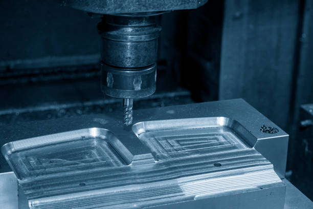 istock The vacuum mold  manufacturing process by CNC milling machine with end mill tool. 1382375776
