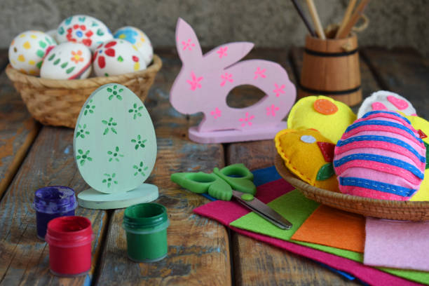istock Making handmade easter eggs from felt with your own hands. Childrens DIY concept. Easter decoration 1382381698