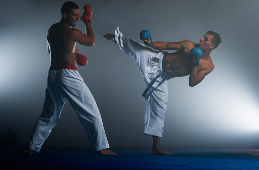 Two fighters posing at Aikido training in martial arts school. Healthy lifestyle and sports concept