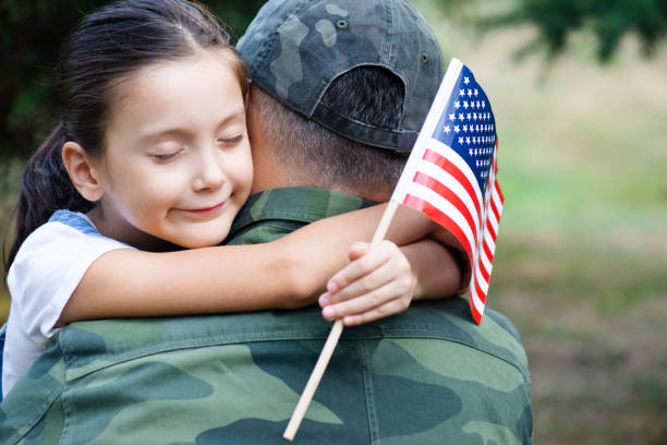 istock American Soldier And His Daughter 1382384641