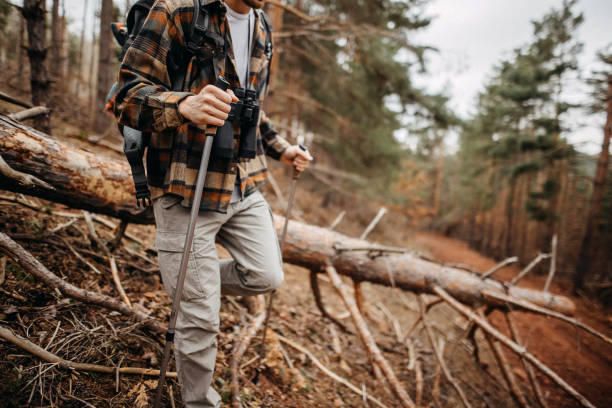 Young man who enjoy hiking and spending time in nature, spending sunny winter day deep in the woods
