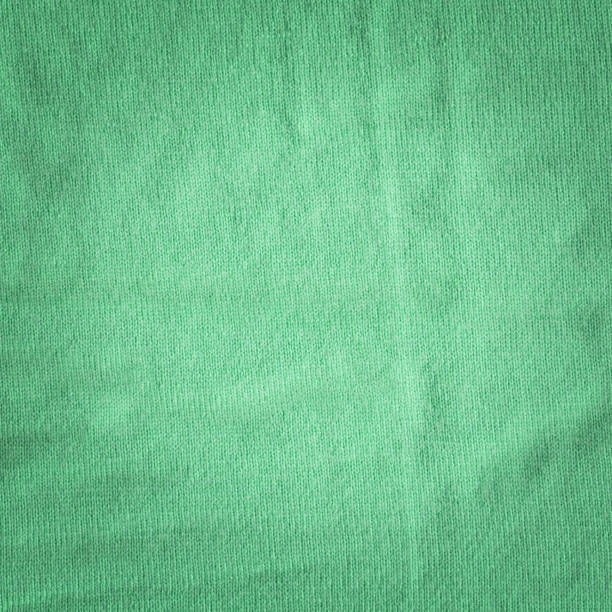 istock Warm green khaki knitted wool background. Beautiful knitted wool textiles as a background 1382385696