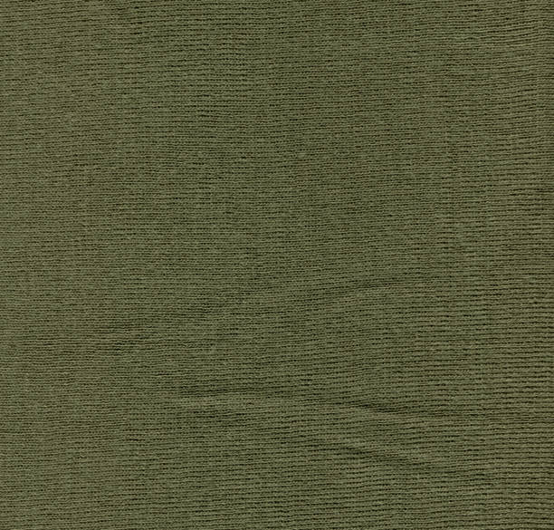 istock Warm green khaki knitted wool background. Beautiful knitted wool textiles as a background 1382385929