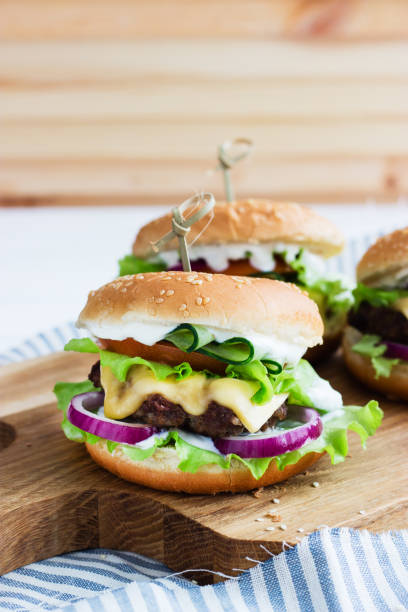 istock Delicious burgers beef takeaway. 1382386052