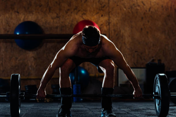 istock Cool man raising barbell 1382386662