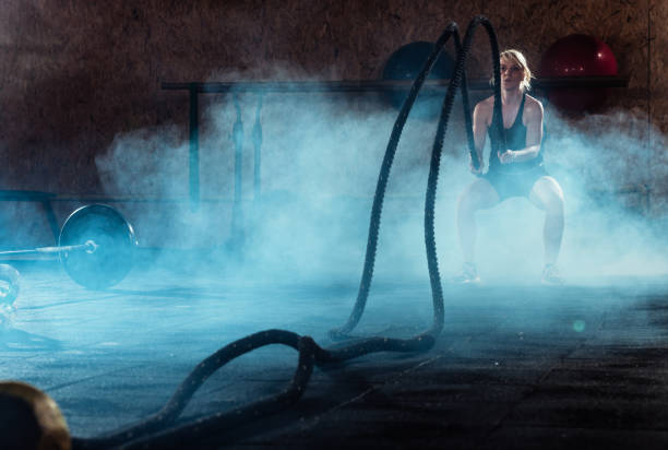 istock Battle ropes exercise in the gym center 1382386802