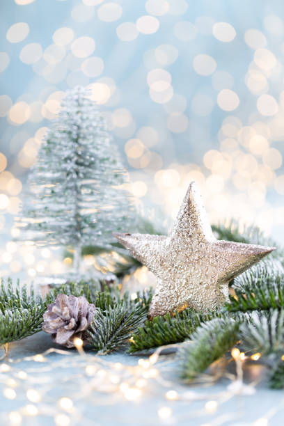 istock Christmas spruce with star and blurred shiny lights. 1382386995