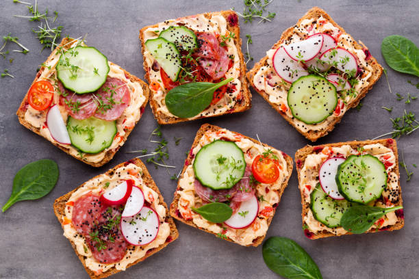 istock Sandwiches with cream cheese, vegetables and salami. 1382387030