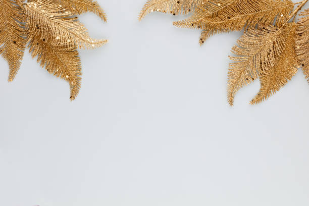 istock Palm gold leaf on blue background. Palm leaf, Flat lay and top view. 1382388625