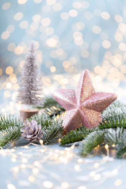 istock Christmas spruce with star and blurred shiny lights. 1382389956