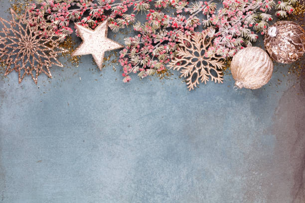 istock Christmas composition fir tree branches, gold sterne on blue background. 1382390302