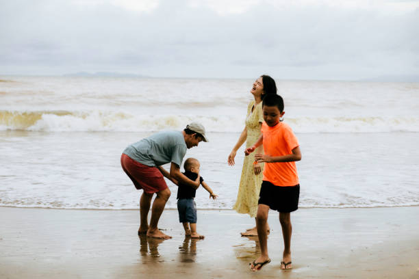 istock happy family on the beach 1382397272