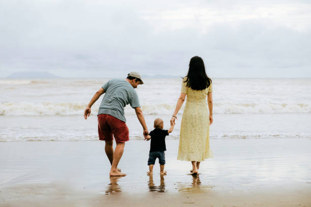 istock happy family on the beach 1382397340