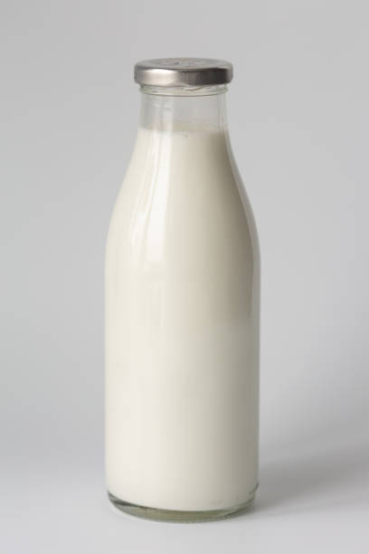istock Glass bottle with milk on a white background 1382397860