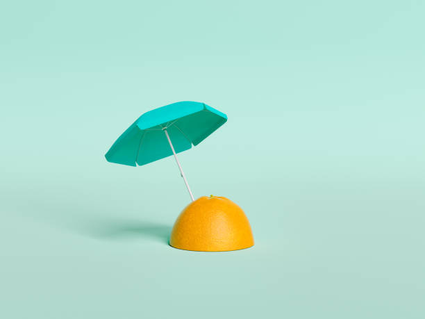 istock half orange with an umbrella stuck in it 1382401599