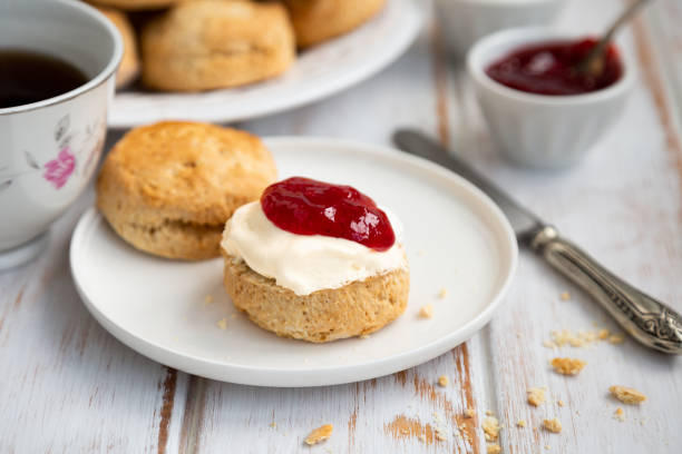 istock Tea time with delicious scones with clotted cream and strawberry jam 1382418341