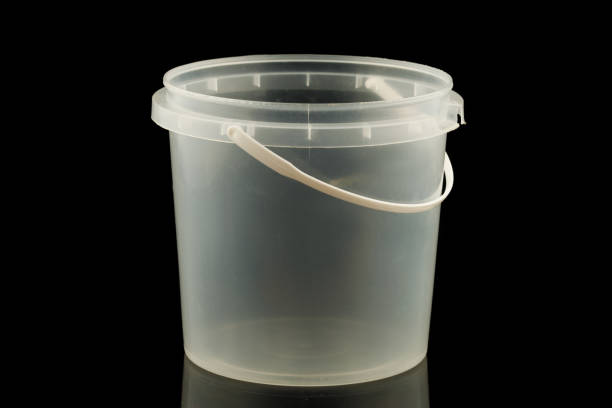 istock White plastic bucket on a black background 1382434858