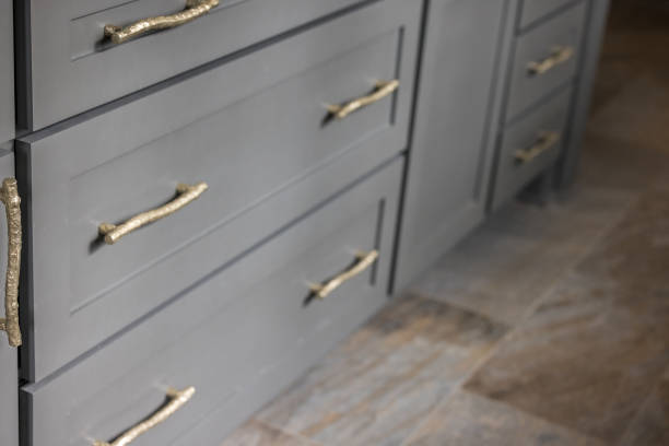 istock Gray kitchen cabinets with modern gold drawer pulls in a recently renovated kitchen 1382443971
