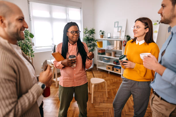 istock Business people talking in office during coffee break 1382445036