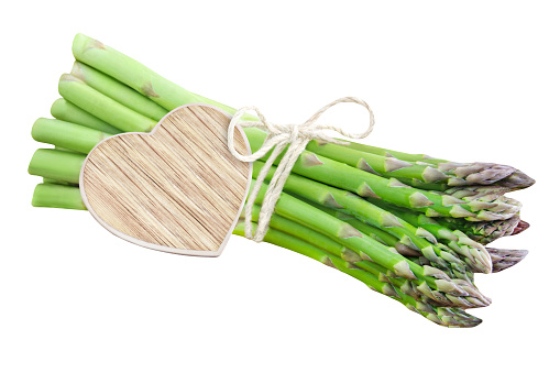 Fresh green Asparagus isolated against white background