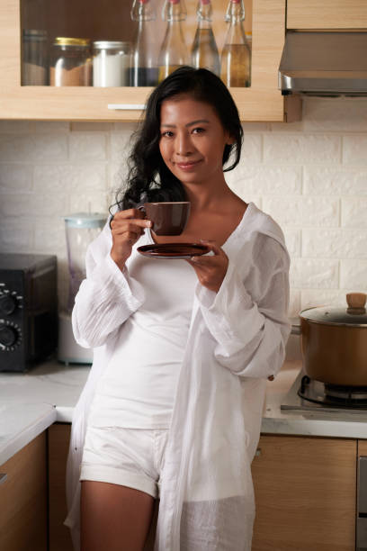 istock Woman Drinking Morning Coffee 1382449408