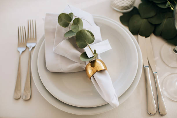 istock Beautiful white table setting for wedding celebration in restaurant 1382459319
