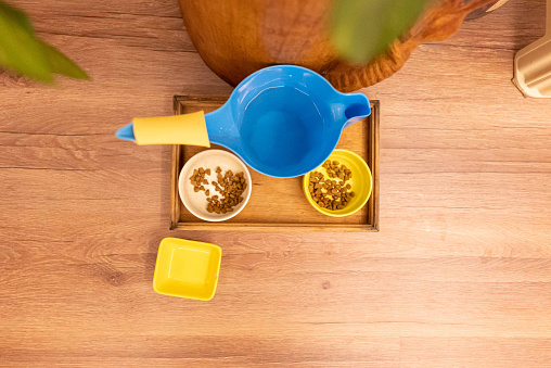 Colored Bowl with dry cat food and water for pet at home