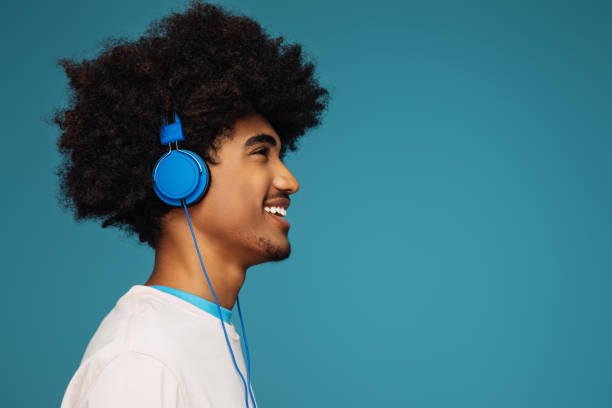 istock African american man with african hairstyle using phone 1382468604