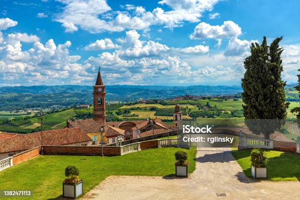 Town Of Govone Overlooking Green Hills Under Beautiful Sky In Italy Stock Photo - Download Image Now