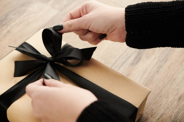 istock Woman Opening Birthday Present 1382479440