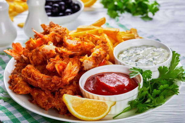 istock deep fried prawn tails with potato fries and sauce 1382479596