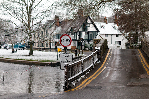 Eynsford Ford in Kent, England, with a Tudor style house in the background.