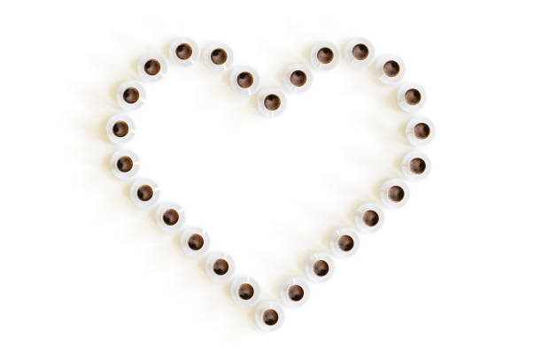 3D Heart Shape made of Coffee Cups Isolated on White Background With Clipping Path