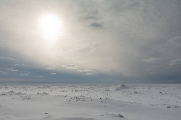 istock Pale Winter Sun Over Frozen Lake Huron 1382488735