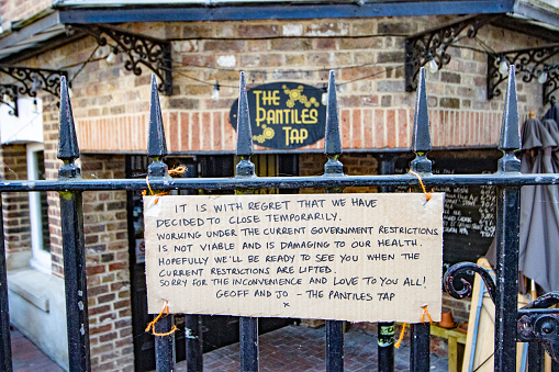 Lockdown Sign at The Pantiles Tap of Royal Tunbridge Wells in Kent, England. The owners are letting customers know that they have temporarily closed because government lockdown restrictions are 'not viable and damaging to our health'.