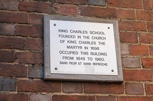 A plaque saying that the King Charles School founded in 1698 was housed in this building between 1848-1960.