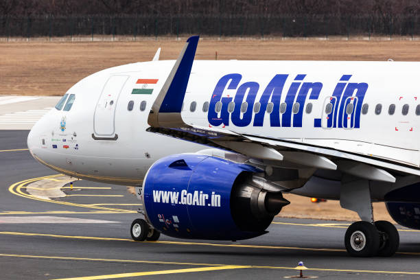 Go First GoAir Airbus A320 NEO passenger plane and aircraft at Budapest Airport. Evacuation special flight for indian citizens because the Ukraine-Russian war. Budapest, Hungary - March 5, 2022: Go First GoAir Airbus A320 NEO passenger plane and aircraft at Budapest Airport. Evacuation special flight for indian citizens because the Ukraine-Russian war. goair stock pictures, royalty-free photos & images