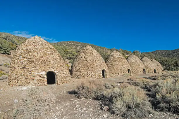 Wildrose Charcoal Kilns, traditional stone masonry 'beehive' charcoal kilns, were built to transform wood from trees in Cottonwood Canyon above the Owens Lake into charcoal, to feed the Cerro Gordo mines. Death Valley National Park, California.