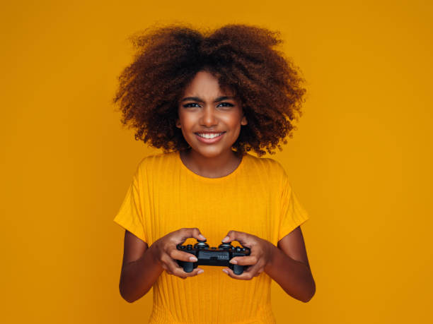 istock Woman holding joystick and playing 1382507599