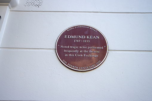 Edmund Kean Memorial Plaque at the Corn Exchange on The Pantiles at Royal Tunbridge Wells in Kent, England. Kean was a ‘noted tragic actor’ who performed regularly at the Corn Exchange which was a theatre. He lived between 1787-1833.