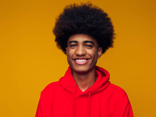 istock Portrait of emotional afro guy using phone 1382509993