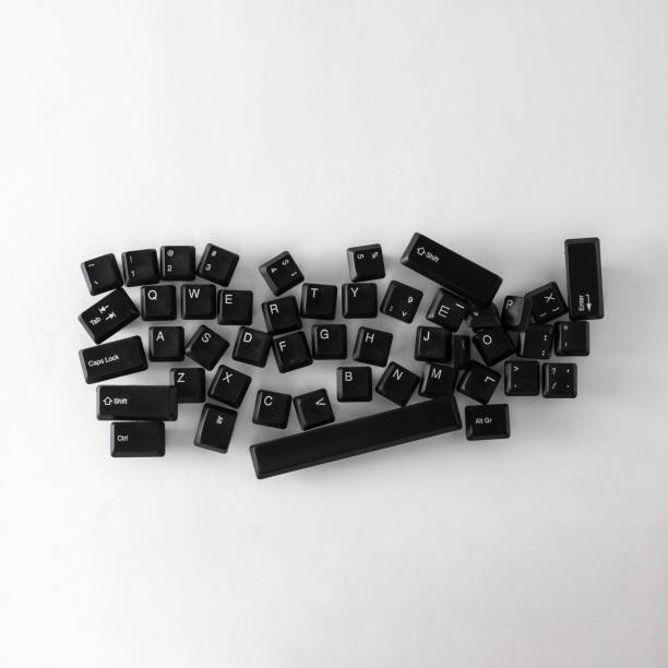 istock black keyboard buttons randomly lie on a white background. abstraction of computer technologies. 1382510228