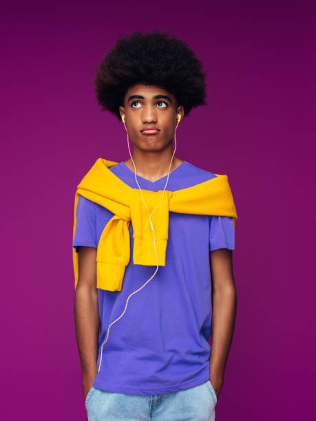 istock Portrait of funny afro guy using phone 1382510237